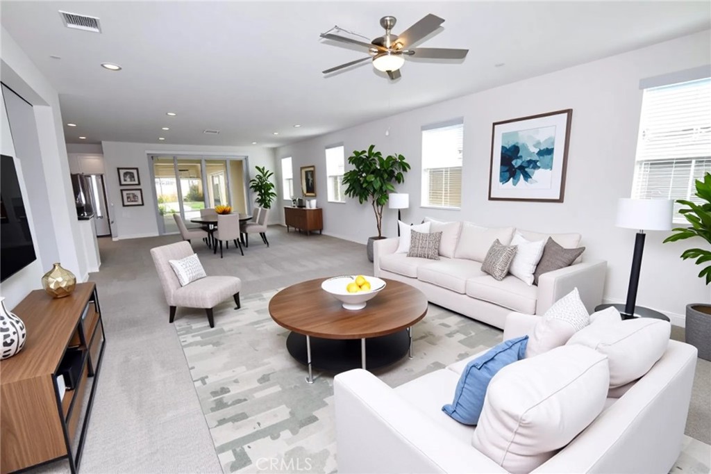39824 Ninebark Court Temecula, CA 92591 - Photo 4 of 32 a living room with furniture a window and a flat screen tv