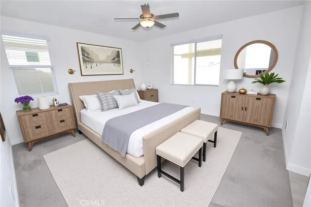 a large kitchen with stainless steel appliances granite countertop a sink and a refrigerator