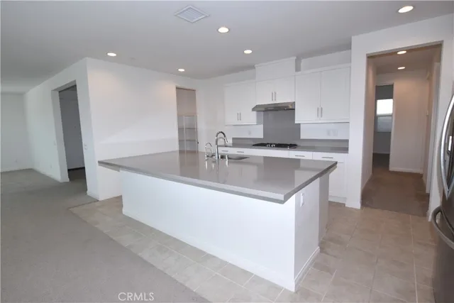 a view of a kitchen with a sink and a window