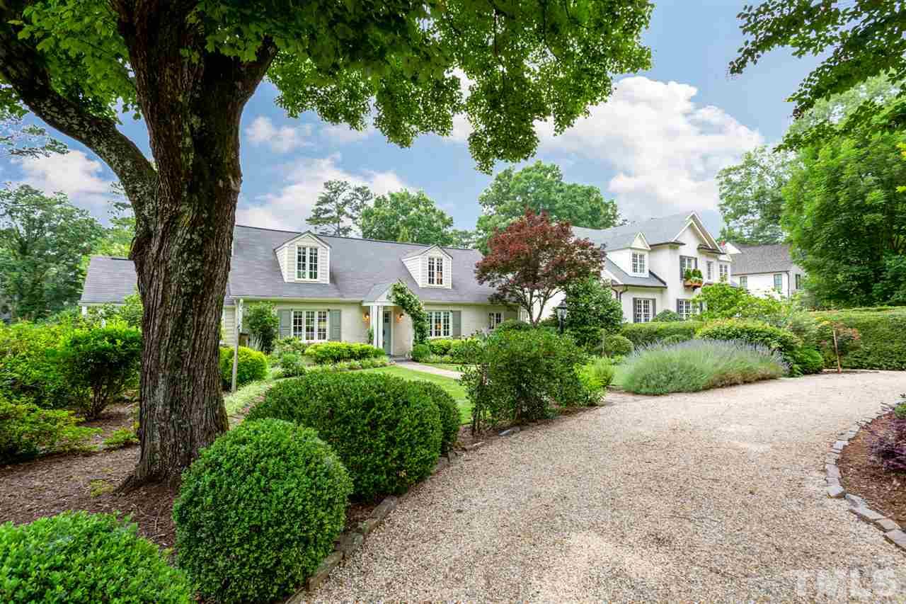1321 Brooks Avenue Raleigh, NC 27607 - Photo 1 of 30 Practical circular drive in addition to a 2-Car Garage! The pea gravel drive with granite borders blends perfectly with the surrounding landscape.