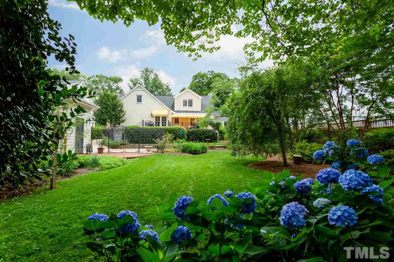 1321 Brooks Avenue Raleigh, NC 27607 - Photo 3 of 30 From the rear of the back yard, the home and landscape is beautiful, especially when the Hydrangea blooms.
