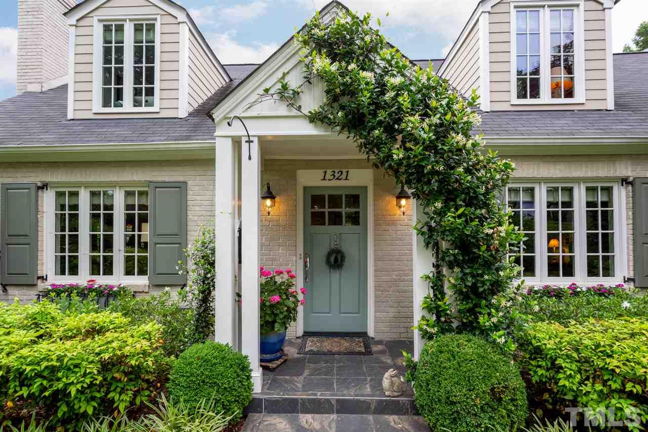 1321 Brooks Avenue Raleigh, NC 27607 - Photo 4 of 30 Welcoming, covered front entry framed with blooming flower boxes, gardenia, jasmine and working wood shutters.