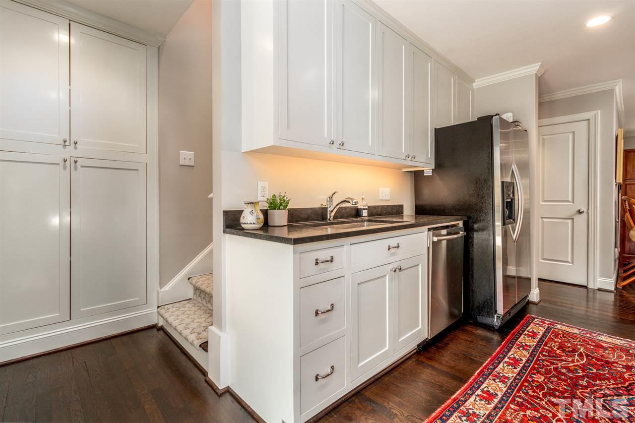 1321 Brooks Avenue Raleigh, NC 27607 - Photo 8 of 30 The timeless Shaker cabinets feature interior plugs so small appliances stay hidden and allow for LOTS of storage.