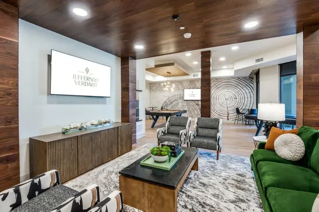 a living room with furniture and a table