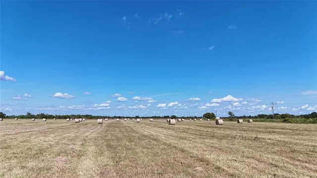 a view of a lake with houses in back
