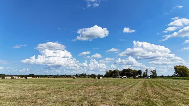a view of a big yard with an outdoor space and seating