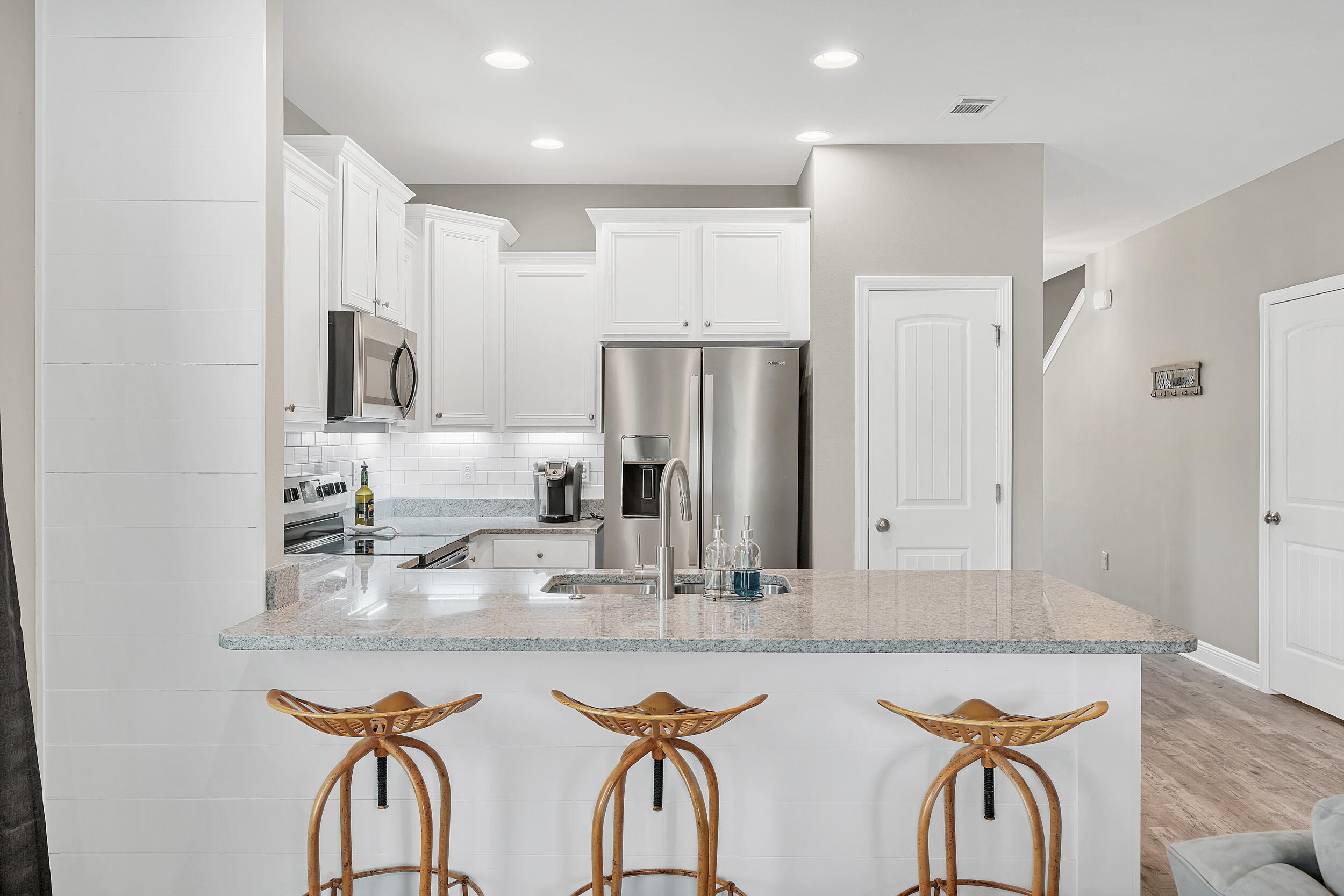 89 Crossing Lane, Unit F Santa Rosa Beach, FL 32459 - Photo 11 of 37 a kitchen with stainless steel appliances granite countertop a sink and a refrigerator