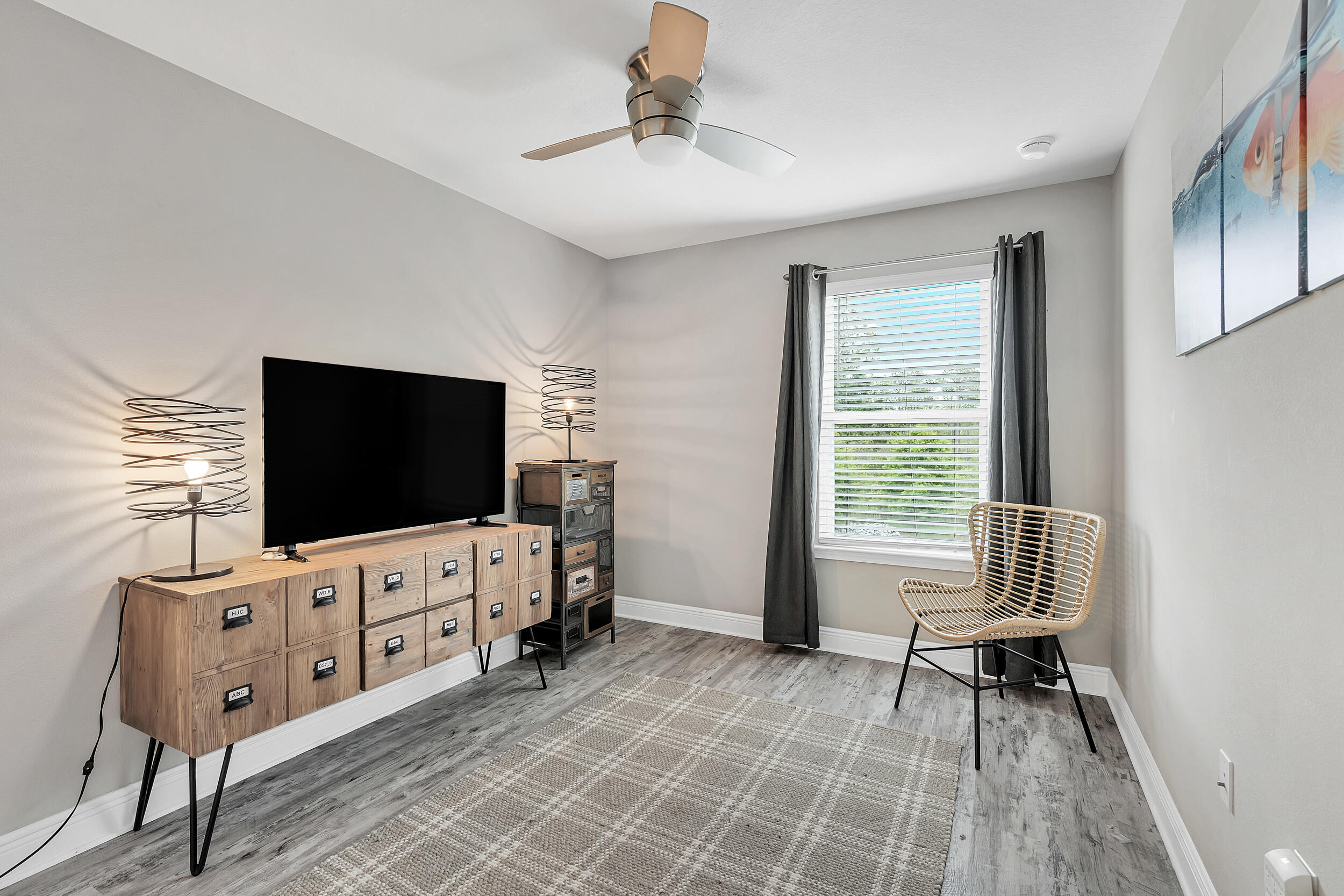 89 Crossing Lane, Unit F Santa Rosa Beach, FL 32459 - Photo 24 of 37 a living room with furniture and a flat screen tv