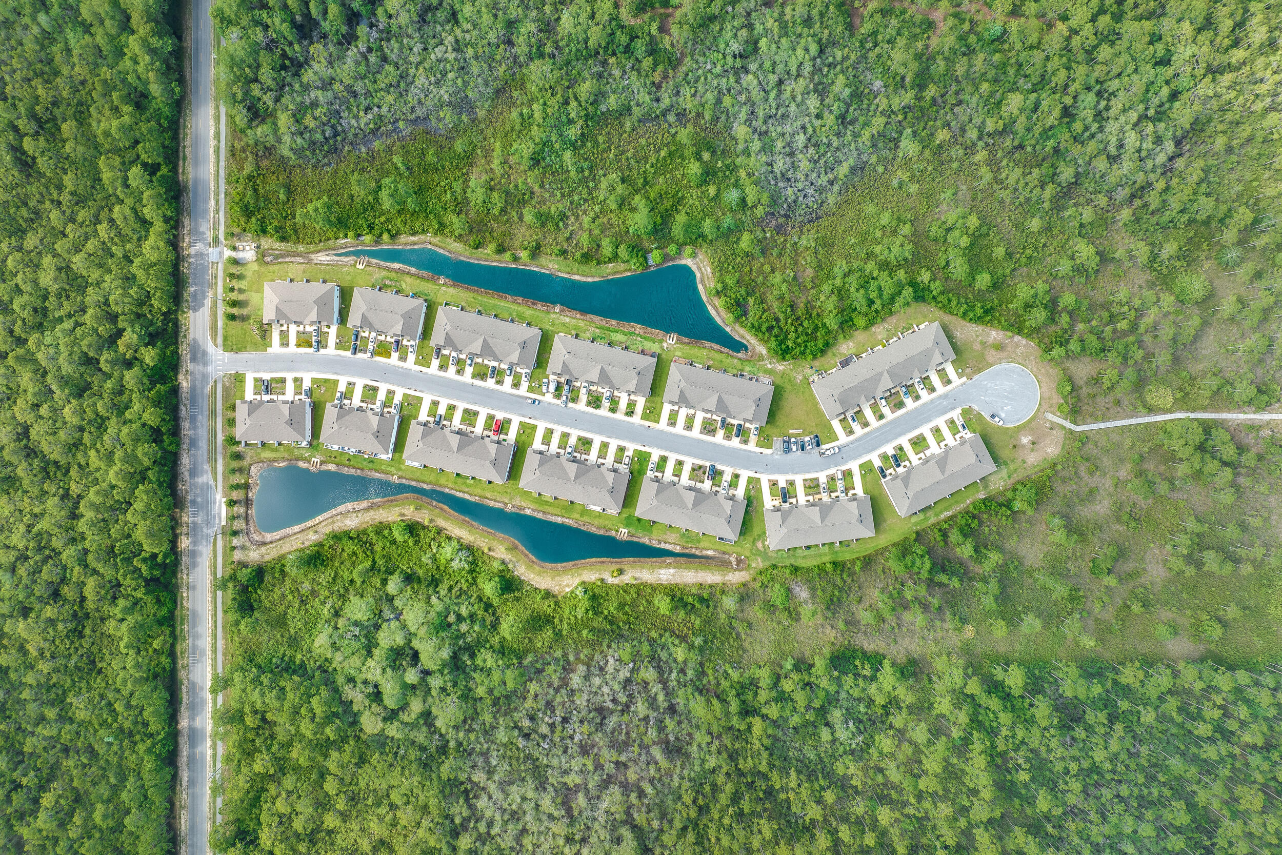 89 Crossing Lane, Unit F Santa Rosa Beach, FL 32459 - Photo 34 of 37 a view of a house with a yard and sitting area