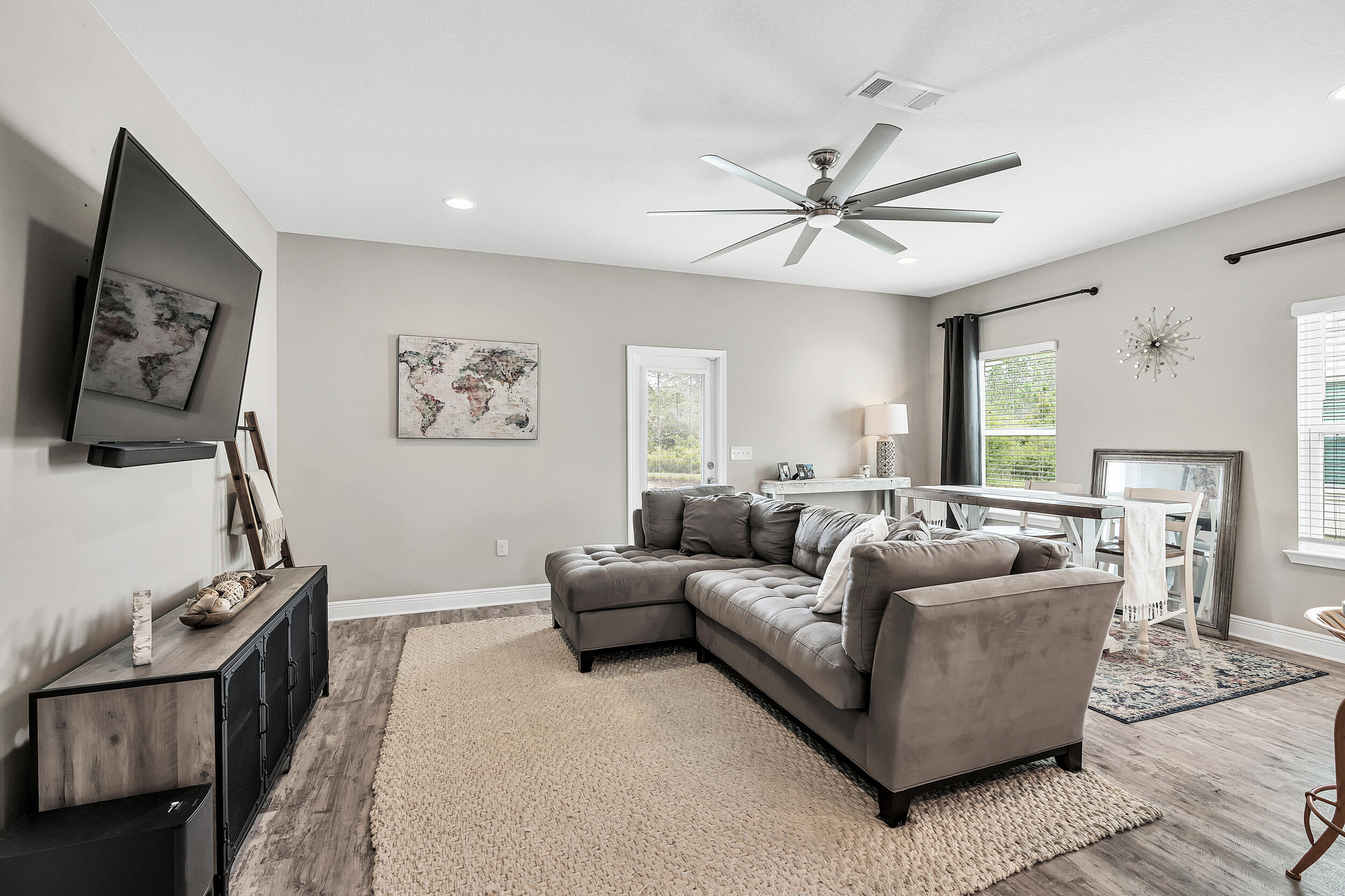 89 Crossing Lane, Unit F Santa Rosa Beach, FL 32459 - Photo 6 of 37 a living room with furniture and a flat screen tv