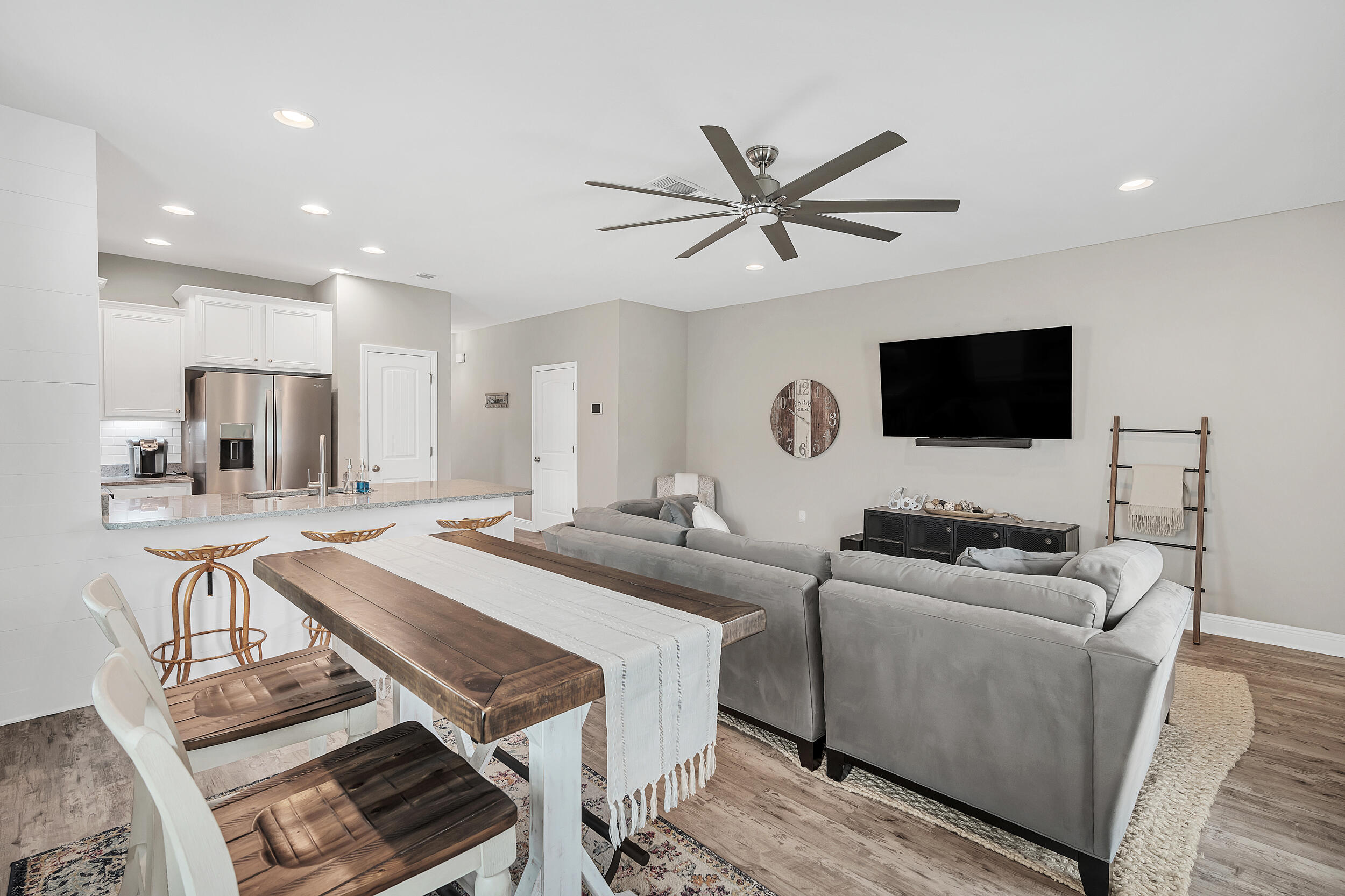 89 Crossing Lane, Unit F Santa Rosa Beach, FL 32459 - Photo 7 of 37 a living room with furniture and a flat screen tv