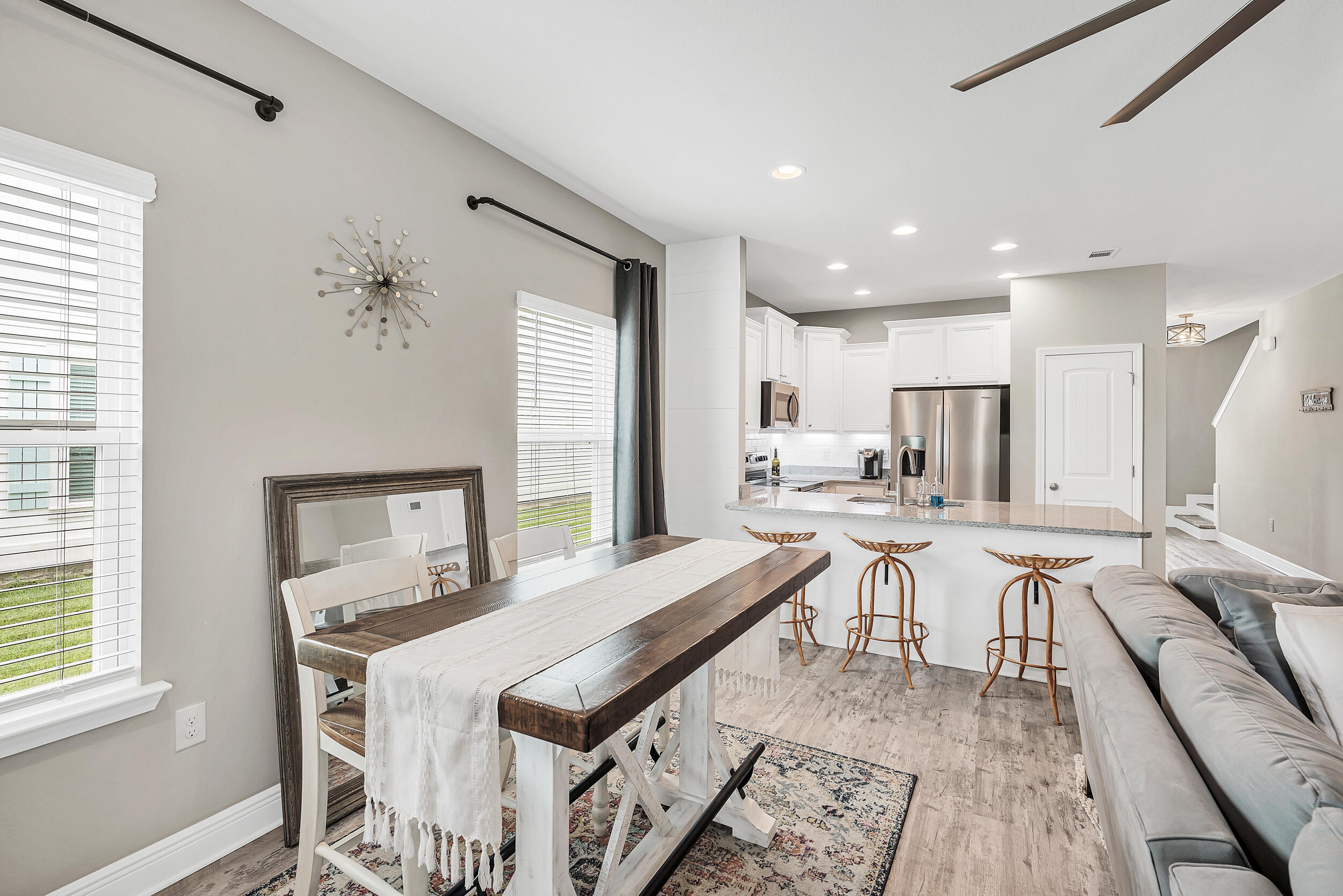 89 Crossing Lane, Unit F Santa Rosa Beach, FL 32459 - Photo 8 of 37 a view of a dining room with furniture window and wooden floor