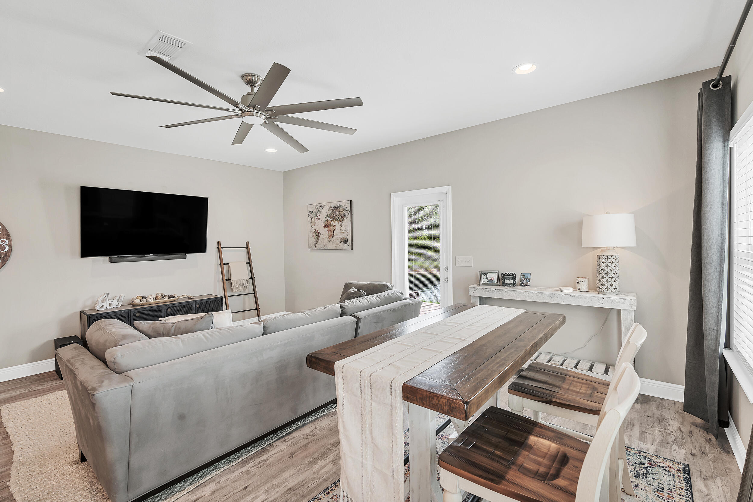 89 Crossing Lane, Unit F Santa Rosa Beach, FL 32459 - Photo 9 of 37 a living room with furniture and a flat screen tv