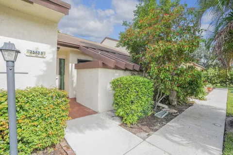 a view of a storage room with water heater and wooden walls