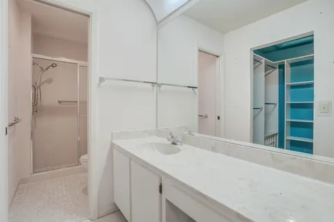 a bathroom with a shower and a toilet