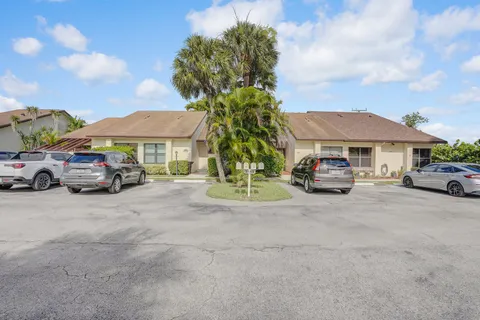a view of backyard with outdoor seating and plants