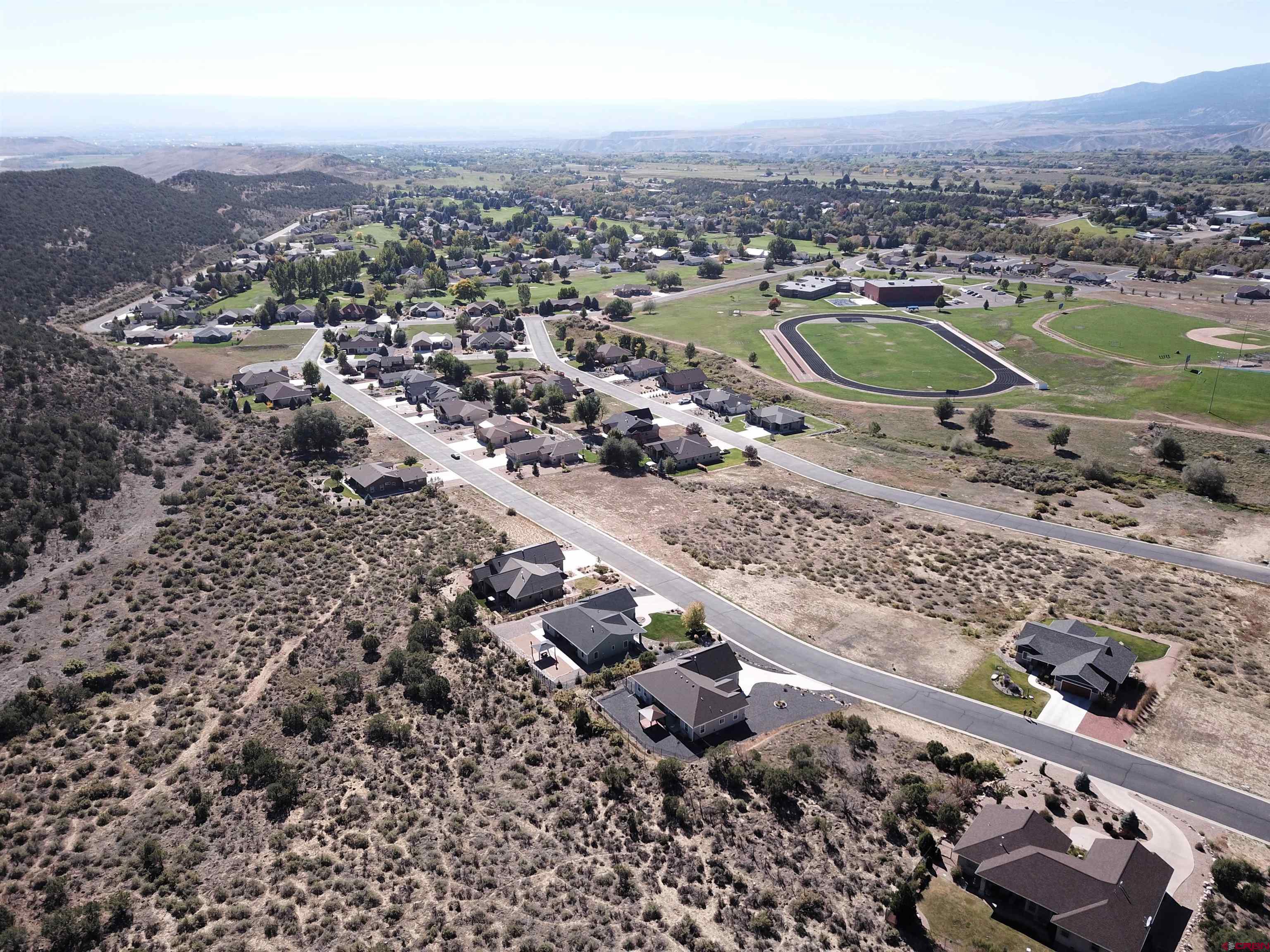 725 Southeast Pine Street Cedaredge, CO 81413 - Photo 3 of 11 an aerial view of multiple house