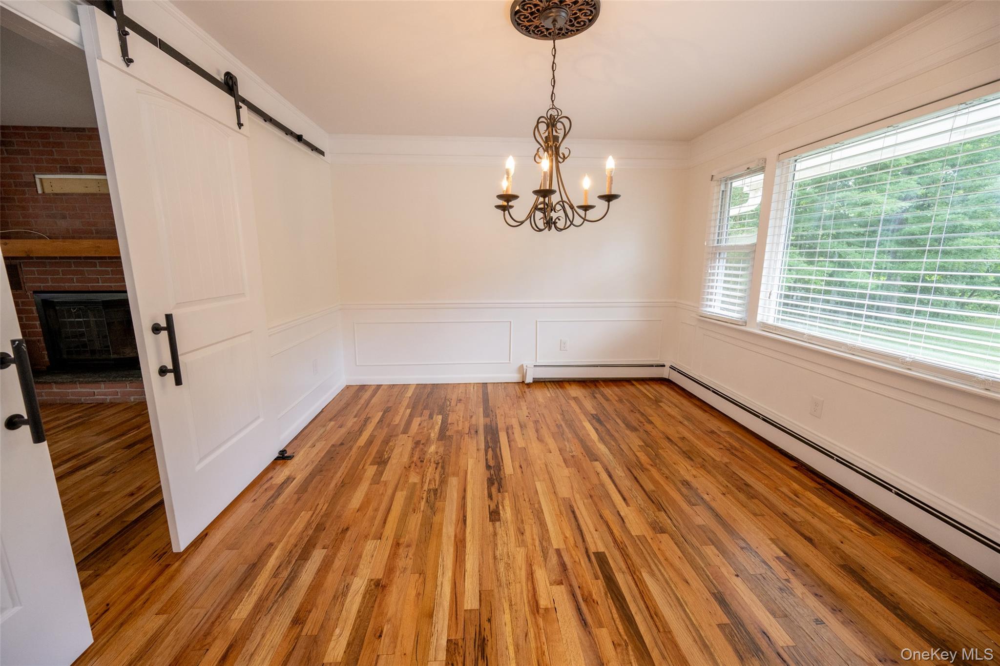 136 Foggintown Road Brewster, NY 10509 - Photo 14 of 50 a view of empty room with wooden floor and fan