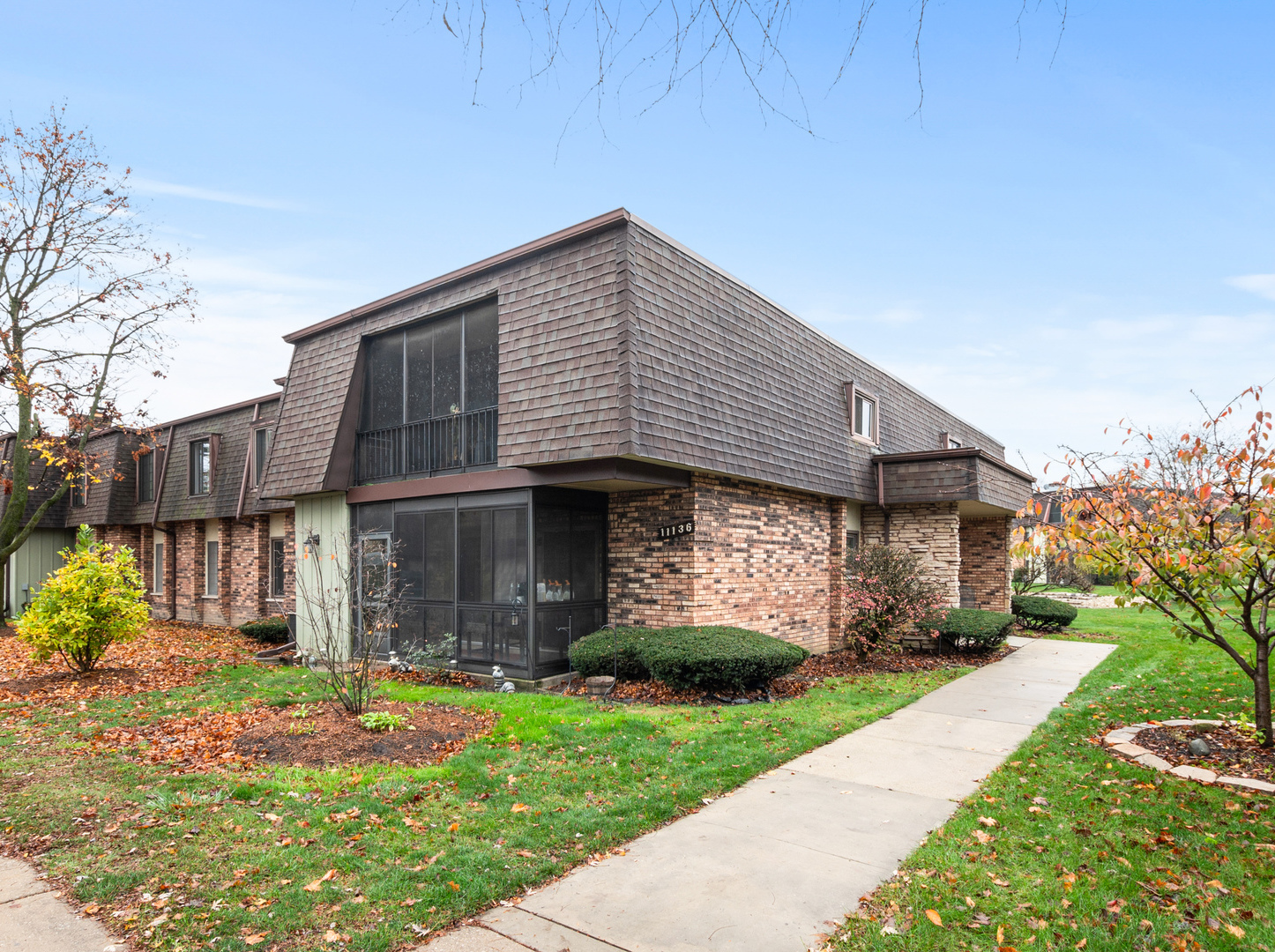 11136 NW Road, Unit D Palos Hills, IL 60465 - Photo 1 of 23 a front view of a house with a garden and plants