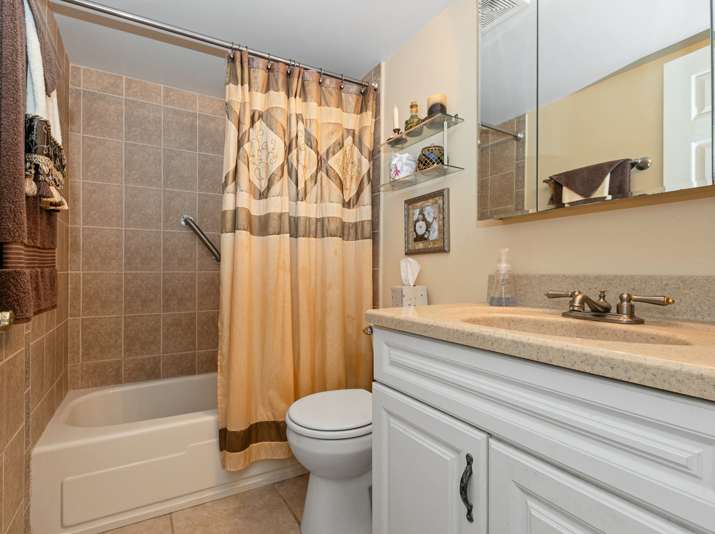 11136 NW Road, Unit D Palos Hills, IL 60465 - Photo 17 of 23 a bathroom with a granite countertop sink a toilet and bathtub