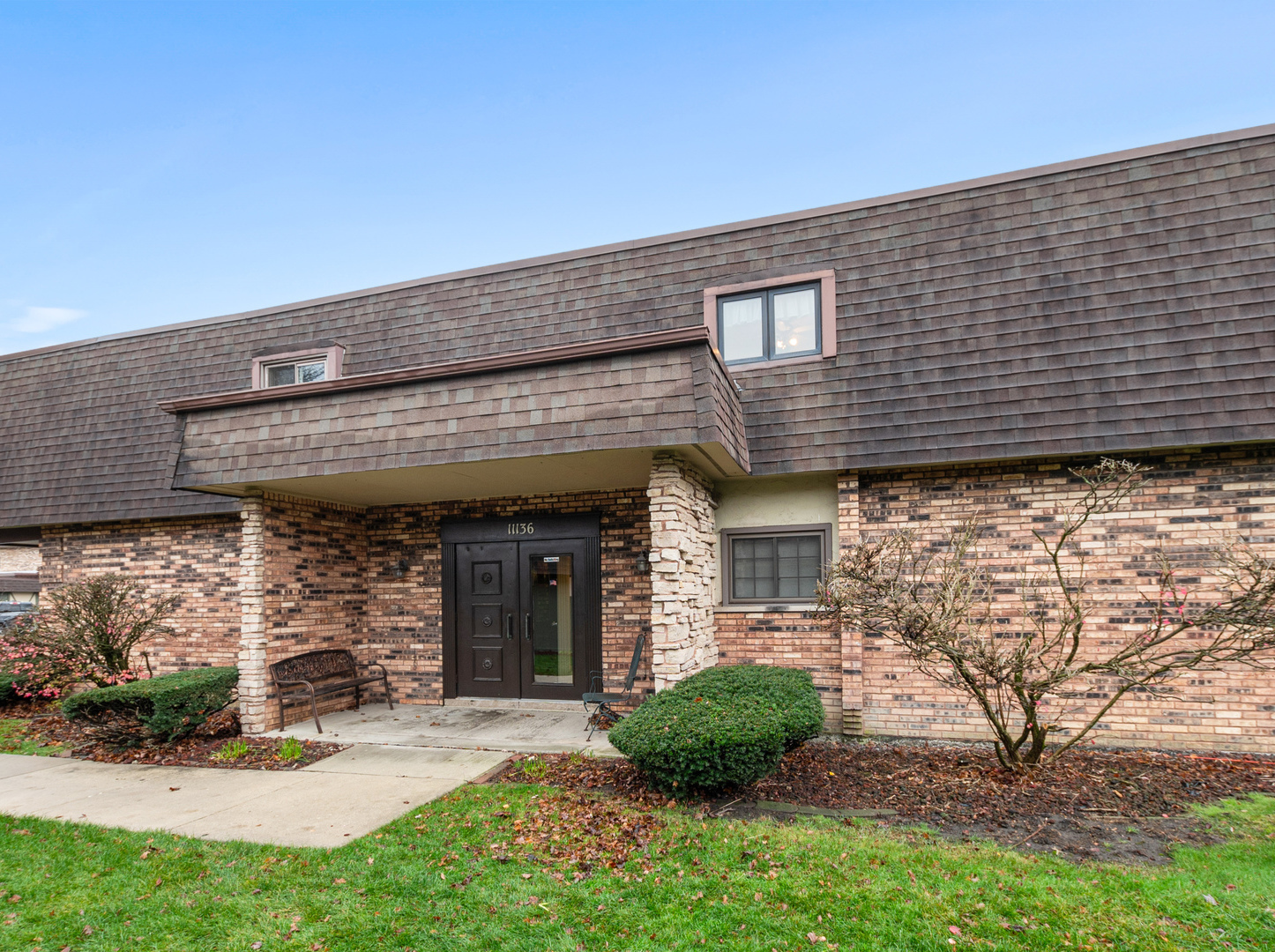 11136 NW Road, Unit D Palos Hills, IL 60465 - Photo 3 of 23 front view of a house with a yard