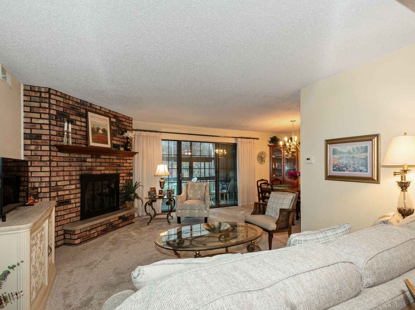 11136 NW Road, Unit D Palos Hills, IL 60465 - Photo 4 of 23 a living room with furniture a fireplace and a flat screen tv