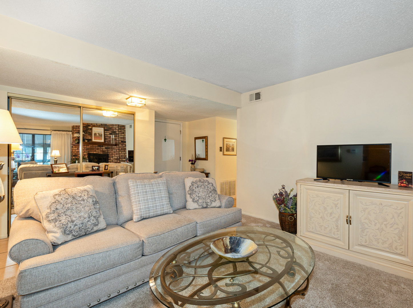 11136 NW Road, Unit D Palos Hills, IL 60465 - Photo 5 of 23 a living room with furniture and a flat screen tv