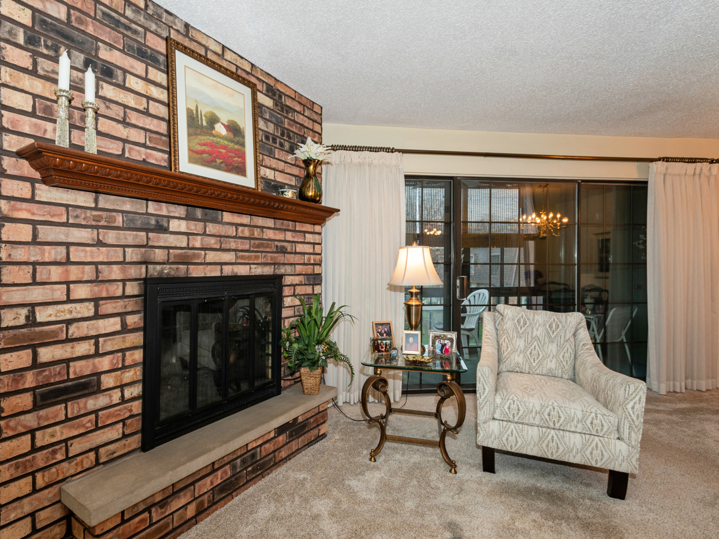 11136 NW Road, Unit D Palos Hills, IL 60465 - Photo 6 of 23 a living room with furniture a fireplace and a floor to ceiling window