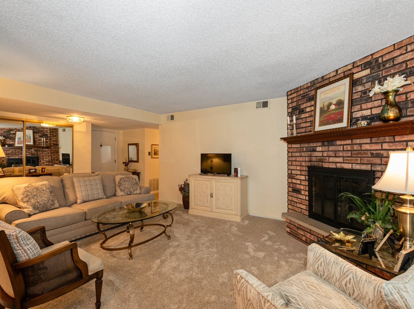 11136 NW Road, Unit D Palos Hills, IL 60465 - Photo 7 of 23 a living room with furniture a flat screen tv and a fireplace