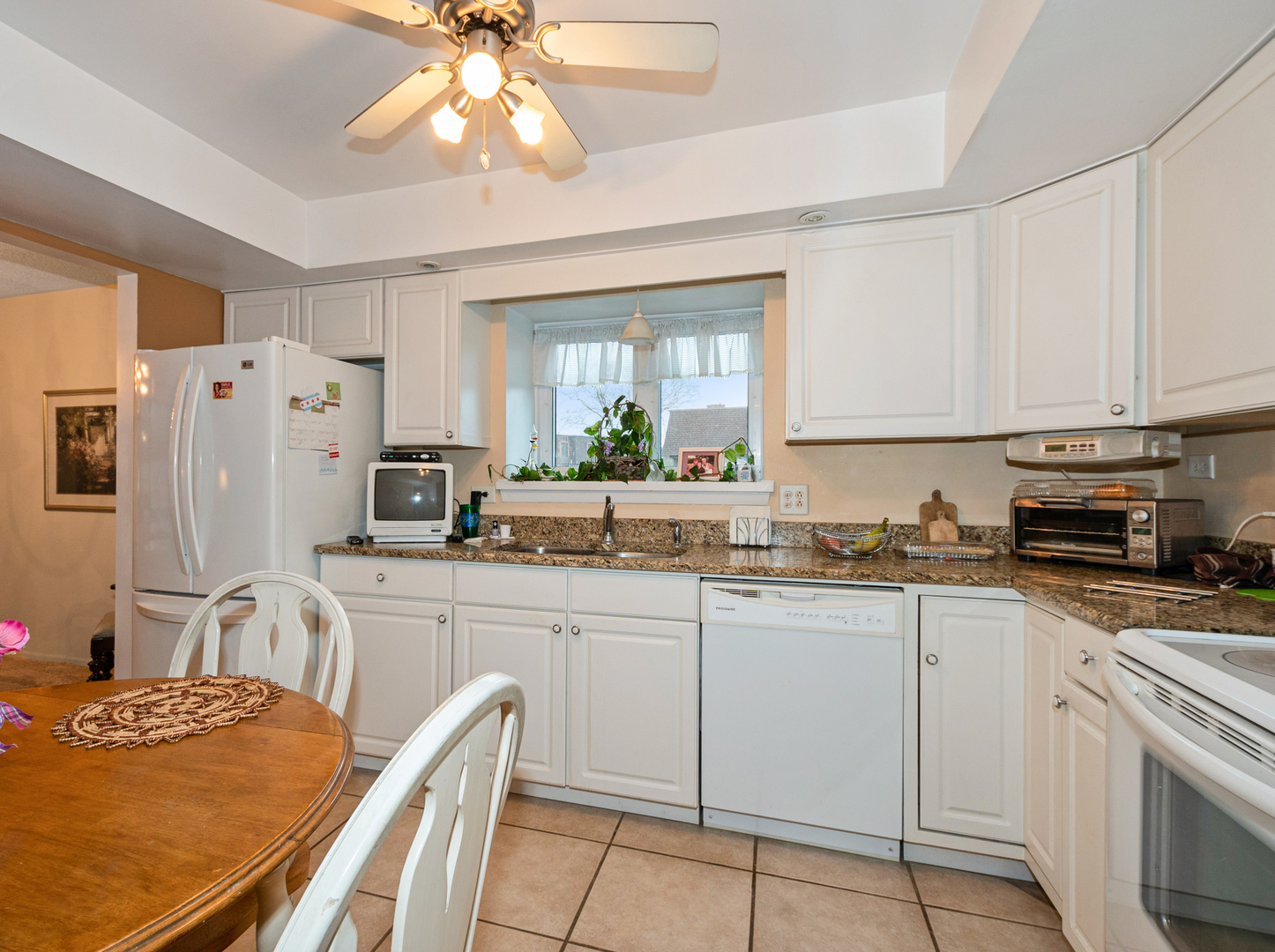11136 NW Road, Unit D Palos Hills, IL 60465 - Photo 9 of 23 a kitchen with stainless steel appliances granite countertop a sink stove and refrigerator