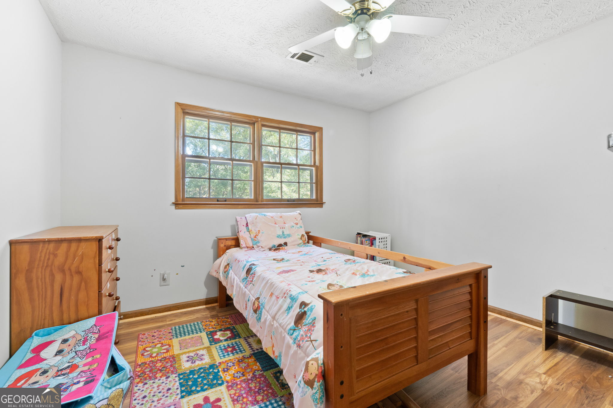 5162 Kurt Lane Southwest Conyers, GA 30094 - Photo 26 of 37 a bedroom with a bed and a chandelier