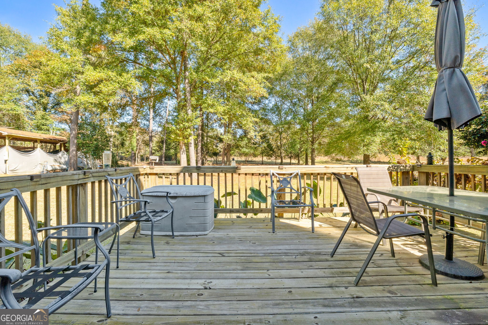 5162 Kurt Lane Southwest Conyers, GA 30094 - Photo 30 of 37 a view of a deck with chairs and wooden floor