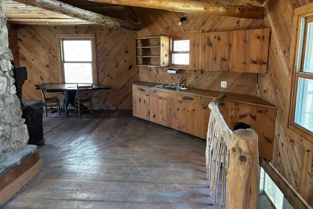 a view of entryway with wooden floor and stairs