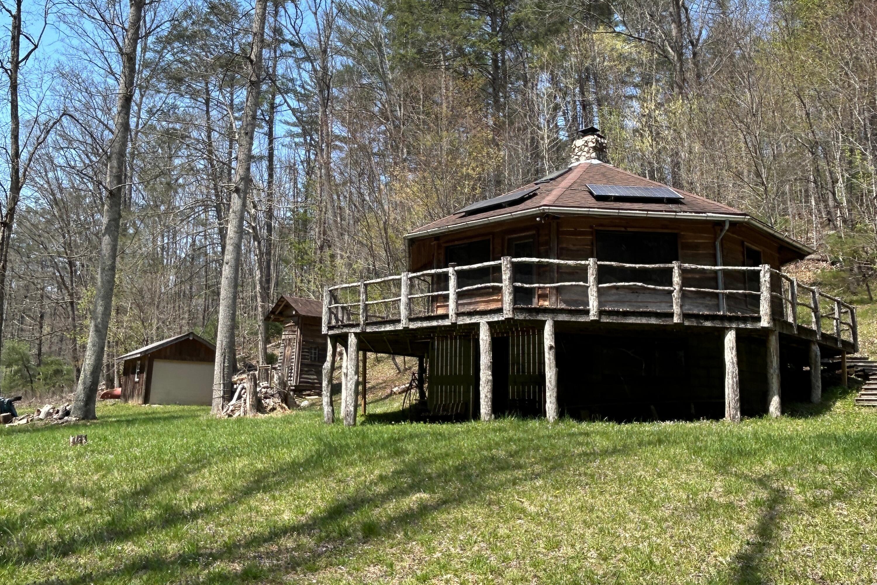 5600 Chestnut Ridge Road Riner, VA 24149 - Photo 2 of 23 a front view of a house with a garden
