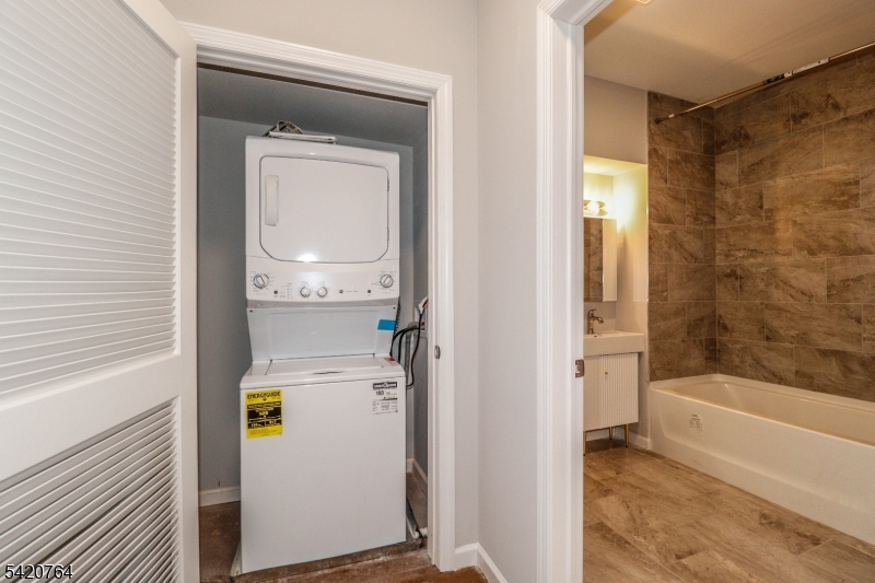 33 2nd Street, Unit 11 Raritan, NJ 08869 - Photo 6 of 7 a bathroom with a bathtub and a shower