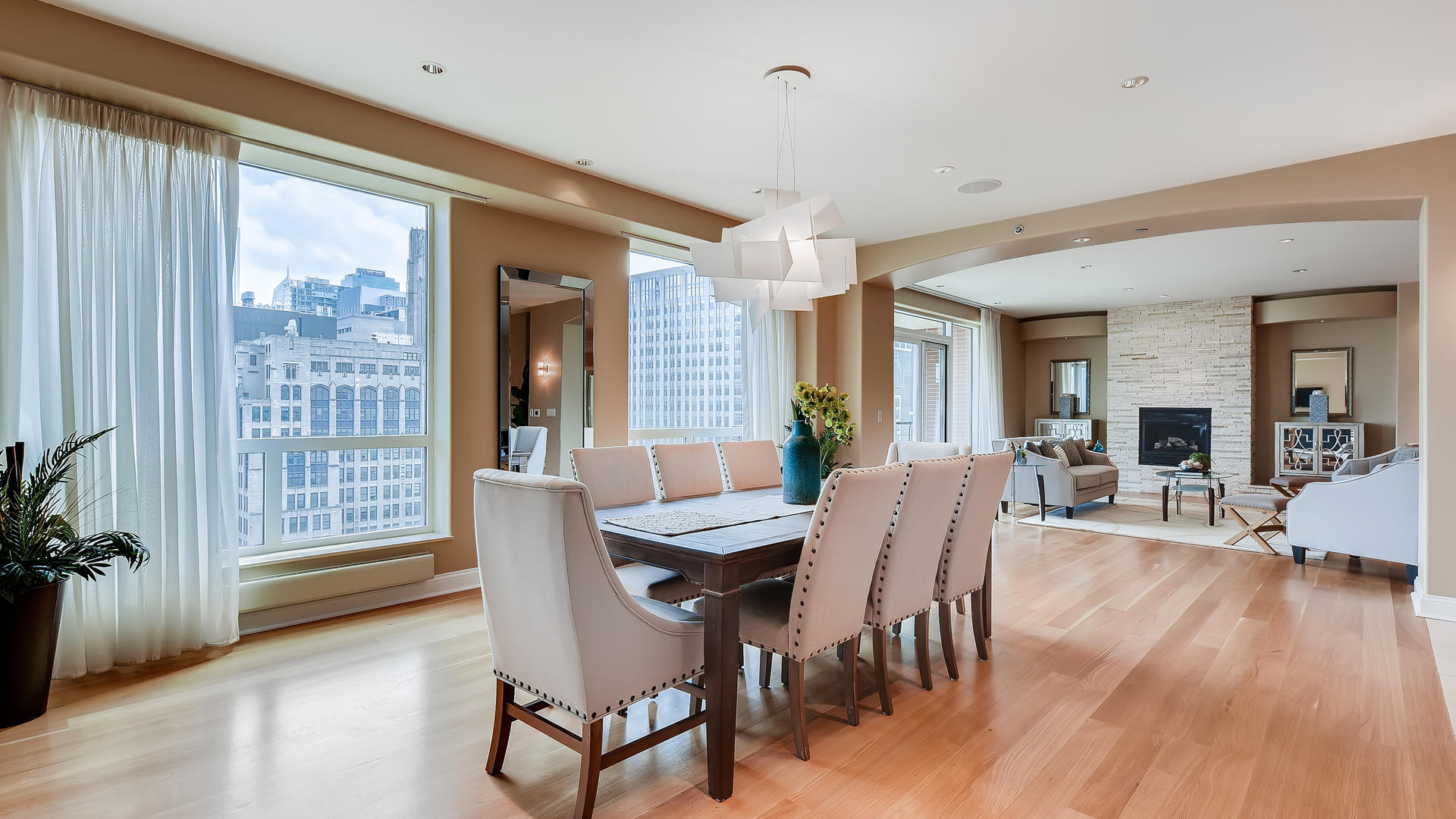 270 East Pearson Street, Unit 1402 Chicago, IL 60611 - Photo 12 of 34 a dining room with furniture and wooden floor