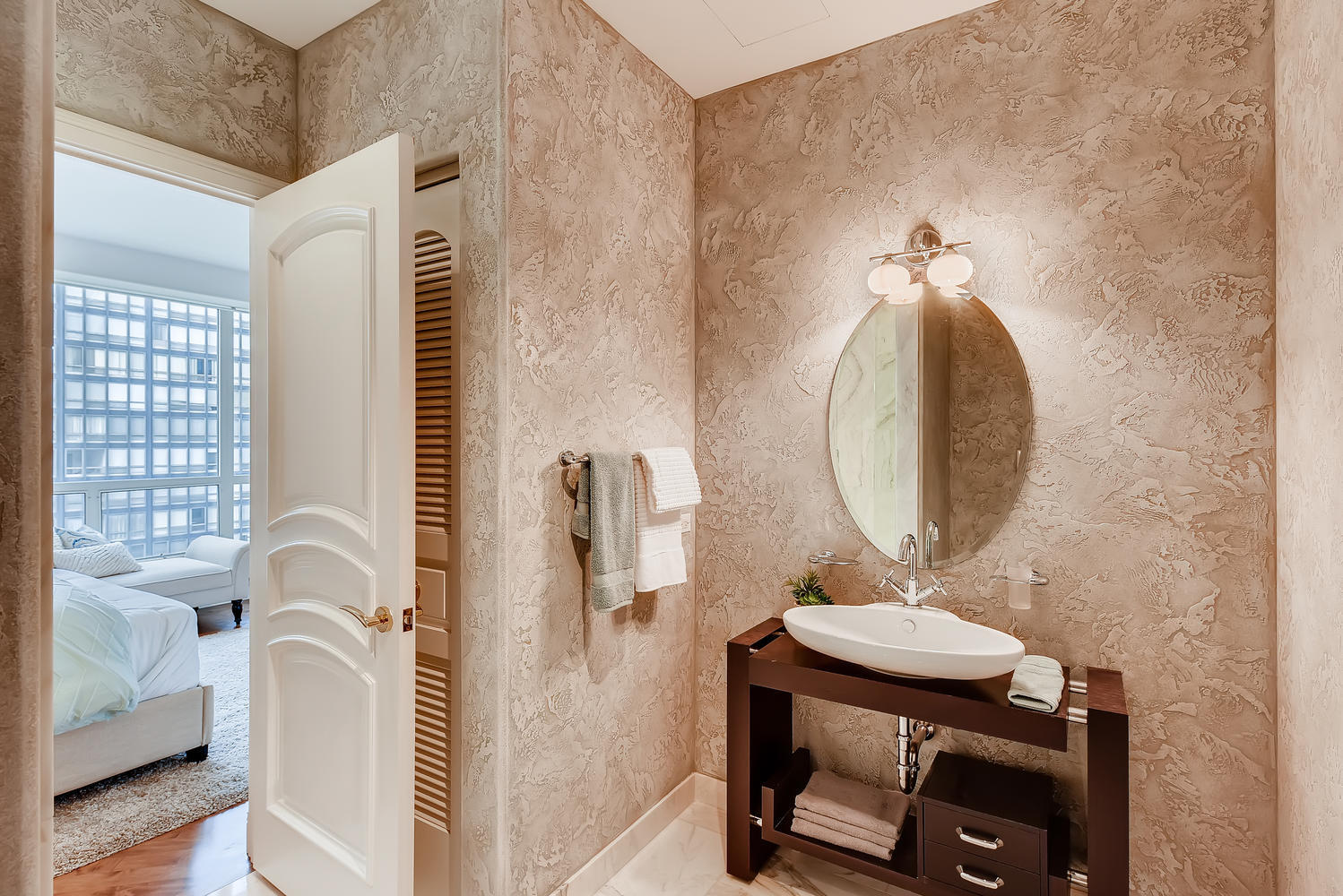 270 East Pearson Street, Unit 1402 Chicago, IL 60611 - Photo 25 of 34 a bathroom with a sink mirror and a bathtub