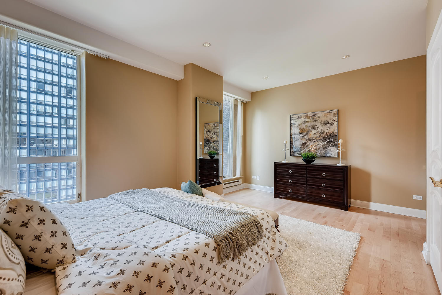 270 East Pearson Street, Unit 1402 Chicago, IL 60611 - Photo 28 of 34 a bedroom with a bed and a dresser