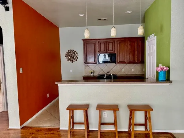 a kitchen with stainless steel appliances granite countertop a sink and cabinets