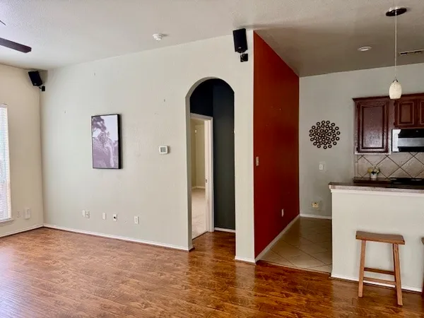 a view of living room with furniture and wooden floor