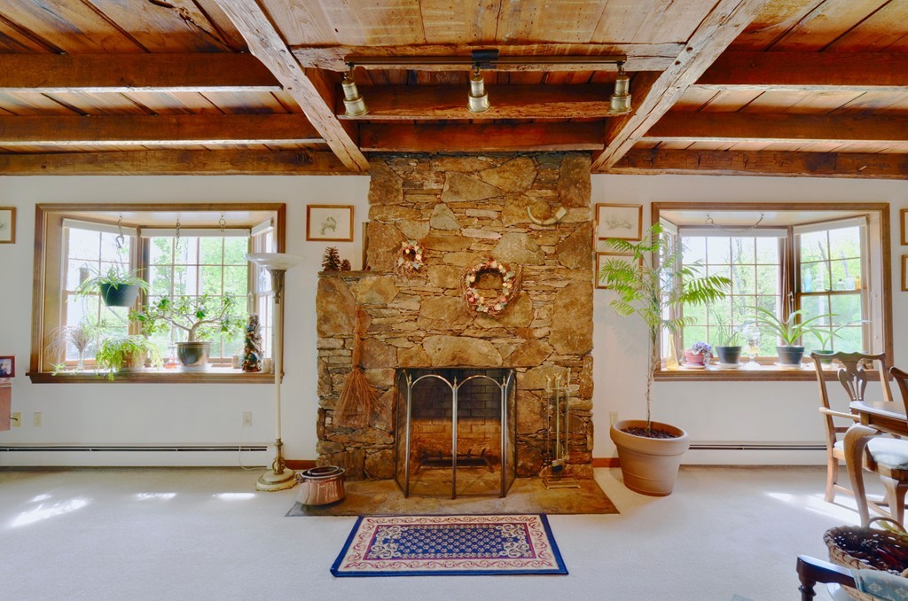 41 Rawson Road Webster, MA 01570 - Photo 14 of 30 a living room with a couch and a fireplace