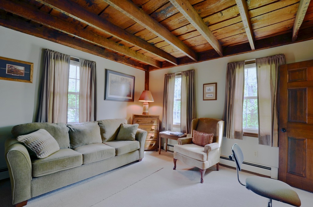 41 Rawson Road Webster, MA 01570 - Photo 24 of 30 a living room with furniture and a chandelier