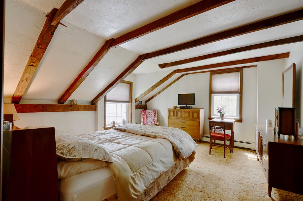 41 Rawson Road Webster, MA 01570 - Photo 26 of 30 a bedroom with a large bed and a flat tv screen