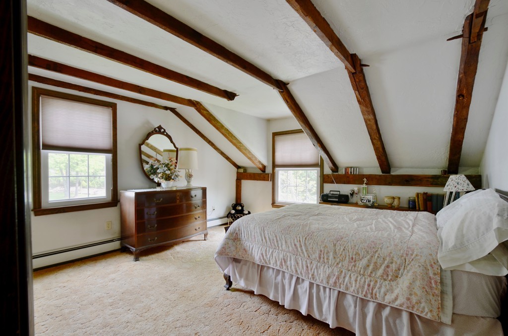 41 Rawson Road Webster, MA 01570 - Photo 27 of 30 a bedroom with a bed a mirror and a window