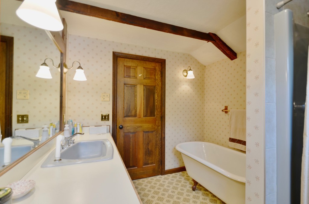 41 Rawson Road Webster, MA 01570 - Photo 29 of 30 a bathroom with a tub a sink and a large mirror