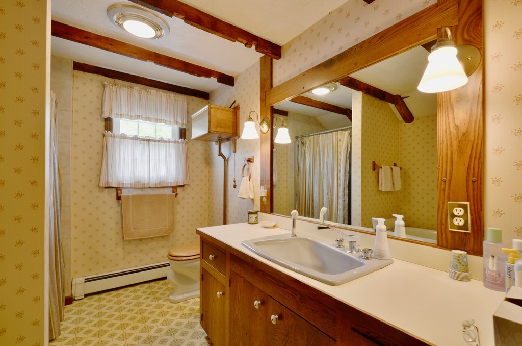41 Rawson Road Webster, MA 01570 - Photo 30 of 30 a bathroom with a sink and a mirror