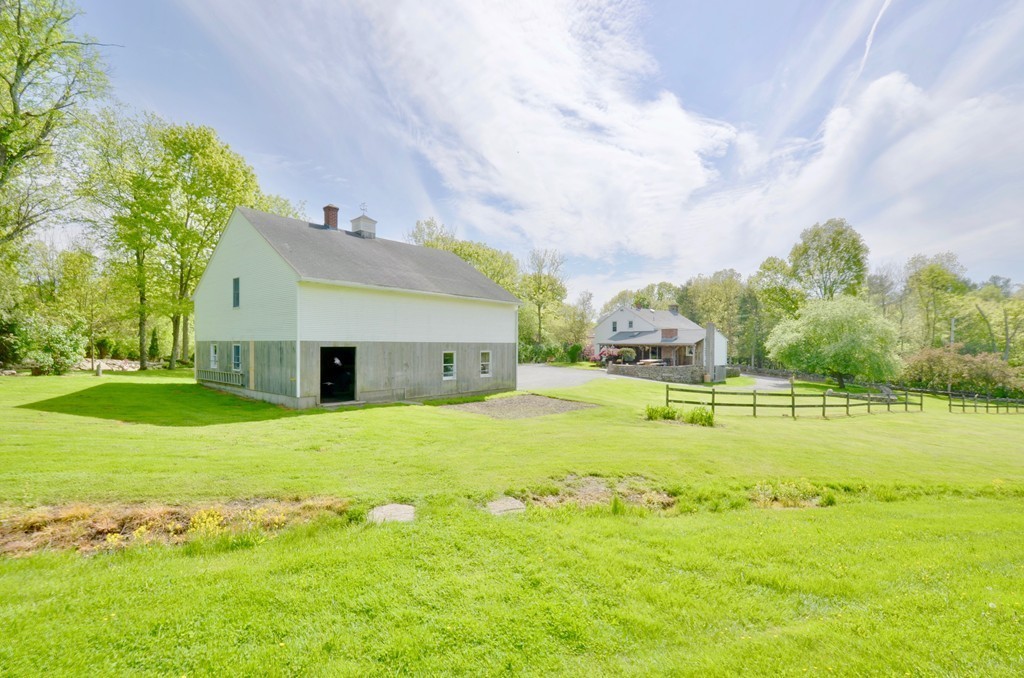 41 Rawson Road Webster, MA 01570 - Photo 4 of 30 a view of a house with a big yard and potted plants