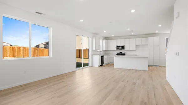 a view of kitchen with wooden floor