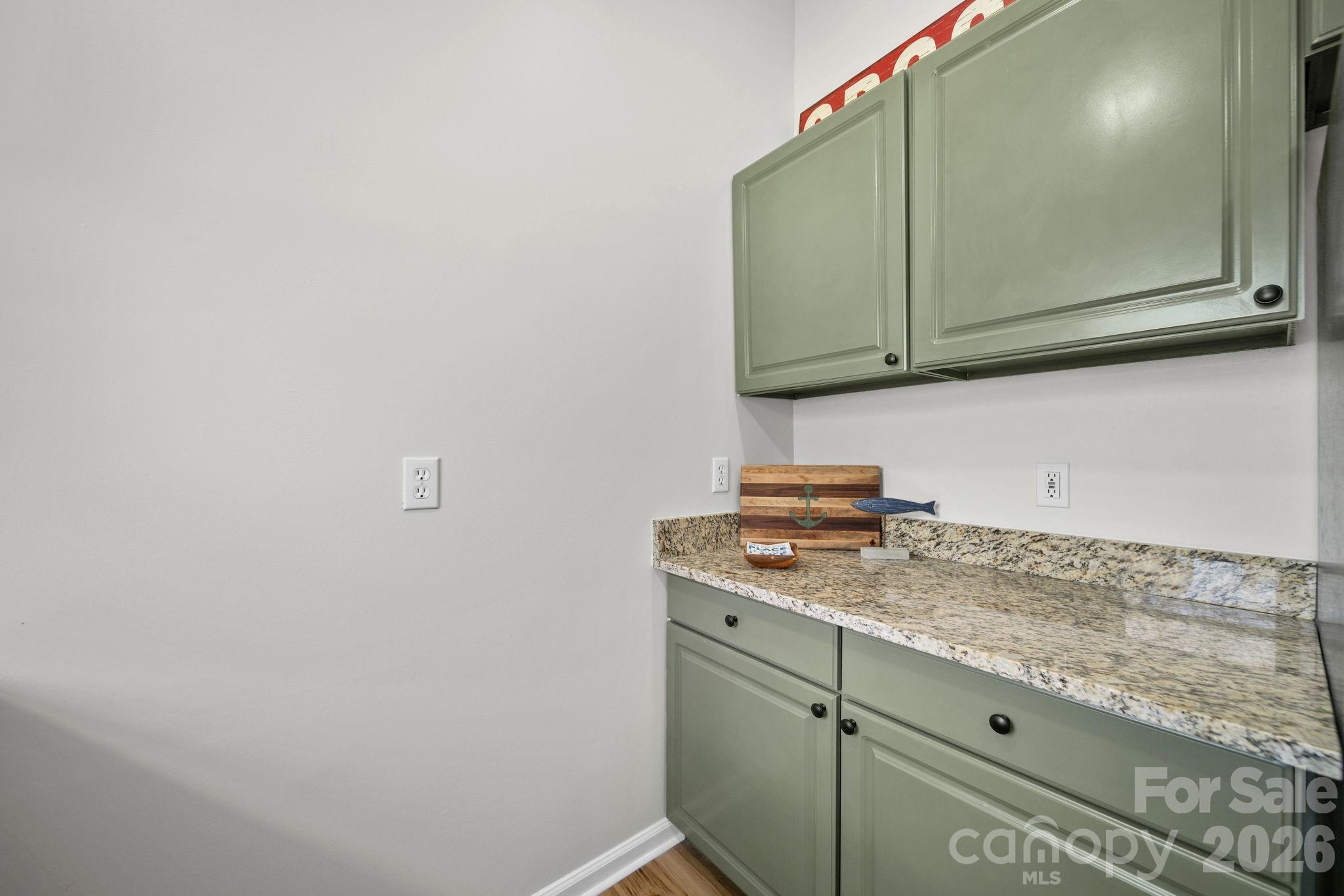 196 Spruce Street Badin, NC 28009 - Photo 12 of 43 a kitchen with a cabinets and a stove top oven