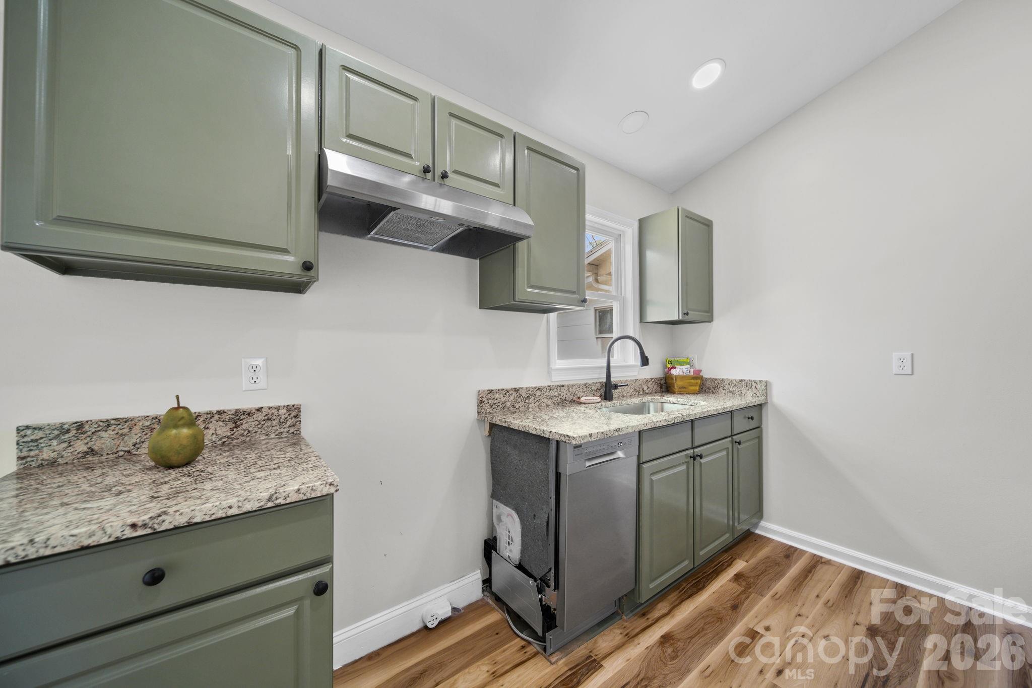 196 Spruce Street Badin, NC 28009 - Photo 14 of 43 a bathroom with a granite countertop sink a vanity and mirror